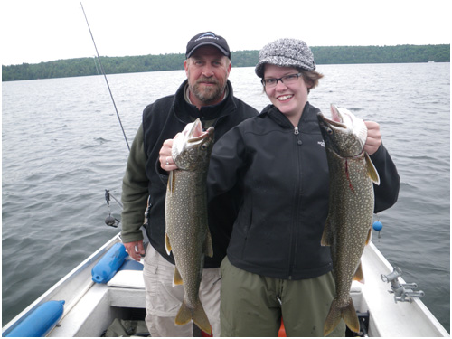 A good catch: two fish on the Lake Memphremagog during a fishing day with the Destination Le Mirage Outfitter